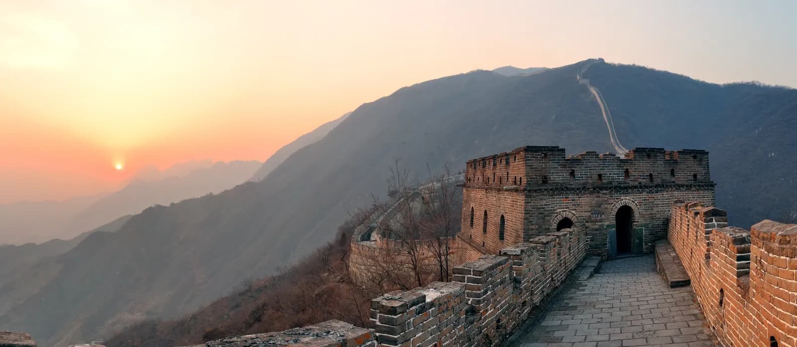 The Great Wall of China at sunset, a destination for Chinese visa applicants from Uganda